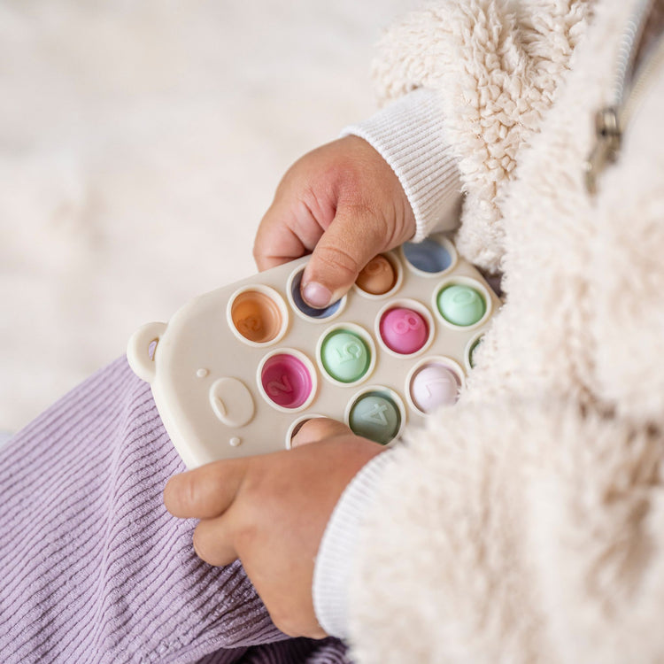 SILICON. Pop-it toy remote